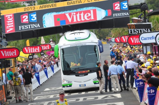 Photo: The Tour de France organizers managed to find a way to remove a bus which was blocking the finish line only minutes before the riders arrived . 