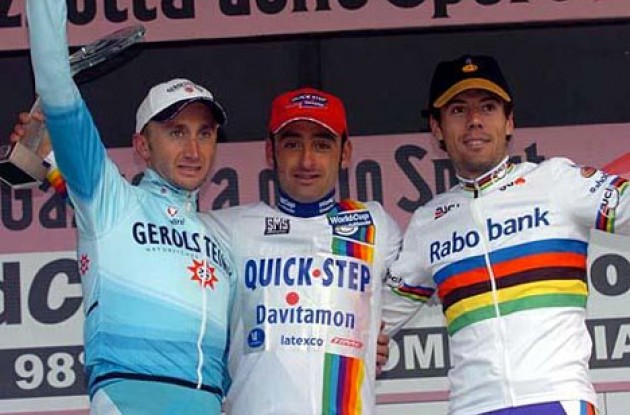 The World Cup podium: From left to right: Davide Rebellin (2nd - Gerolsteiner), Paolo Bettini (1st - Quick.Step), and Oscar Freire (3rd - Rabobank). Photo copyright Fotoreporter Sirotti.