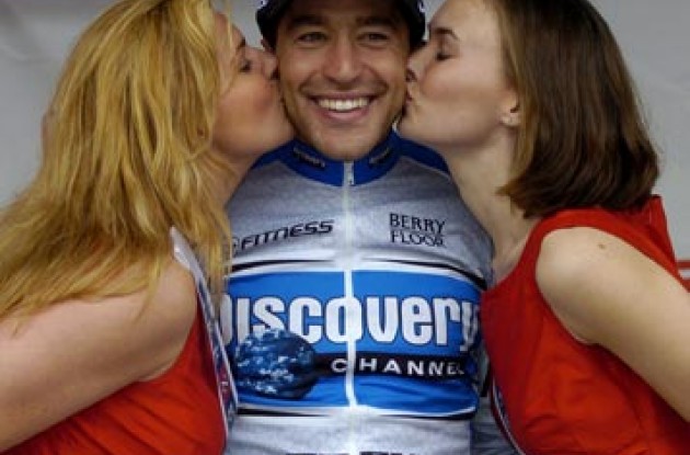 Jose Rubiera of Discovery receives kisses from the podium girls for being named King of the Mountains. Photo copyright Casey Gibson.