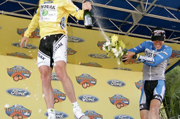 Tom sprays Floyd. Photo copyright Ben Ross/Roadcycling.com/<A HREF="http://www.benrossphotography.com" TARGET=_BLANK>www.benrossphotography.com</A>.