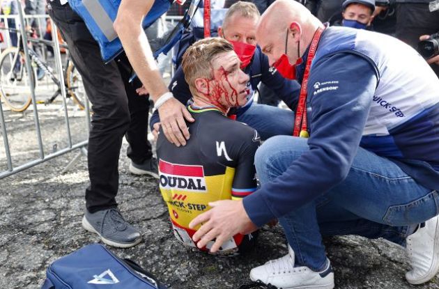 Remco Evenepoel bleeding from his face after crashing in Vuelta a Espana