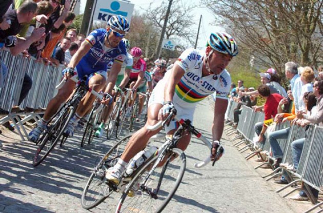 Bettini climbs closely followed by Boonen.