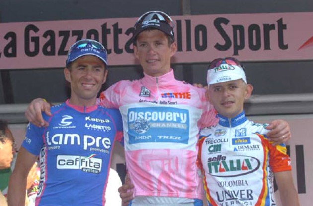 The overall top-3 on the podium. From left to right: Gilberto Simoni, Paolo Savoldelli and Jose' Rujano Guillen. Photo copyright Fotoreporter Sirotti.