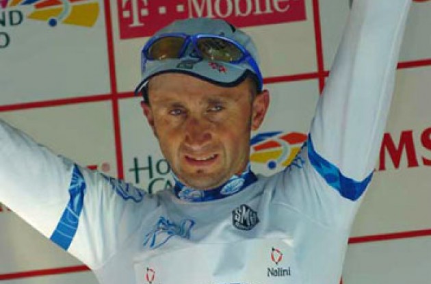 Davide Rebellin on the podium wearing the ProTour leader jersey.