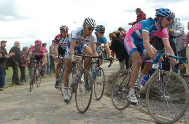 The Boonen-Cancellara group riding hard on a pavé-section. Photo copyright Fotoreporter Sirotti.
