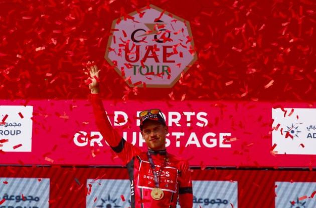 Lucas Plapp on the podium wearing the leaders jersey