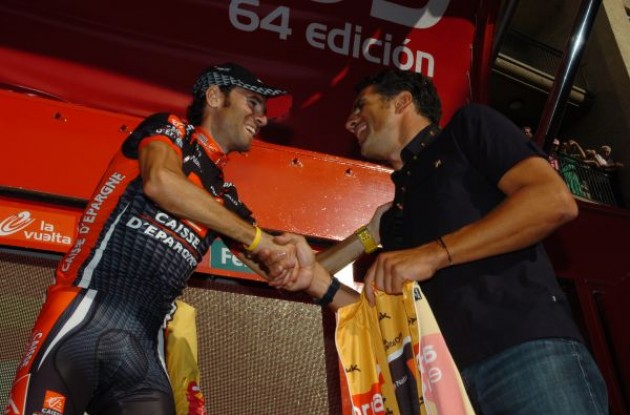 Miguel Indurain hands Alejandro Valverde the golden jersey. Photo copyright Fotoreporter Sirotti.