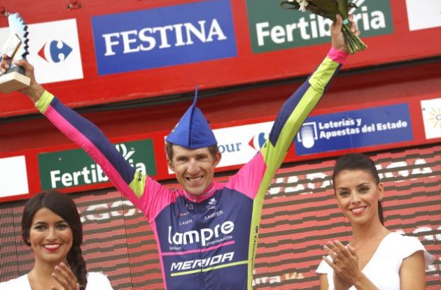 Przemyslaw Niemiec celebrates his stage victory on the Vuelta a Espana podium | Fotoreporter Sirotti
