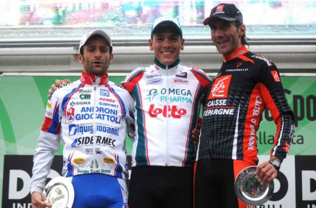 Philippe Gilbert on the 2010 Tour of Lombardy podium with Scarponi and Lastras.