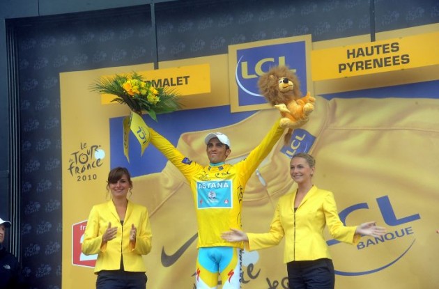 Alberto Contador celebrates his Tour lead on the podium. Photo copyright Fotoreporter Sirotti.