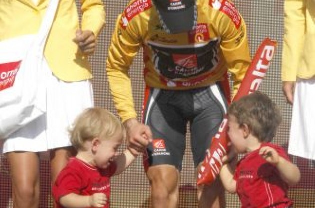 Golden Alejandro Valverde, his kids, and envious podium girl on the podium. Photo copyright Fotoreporter Sirotti.