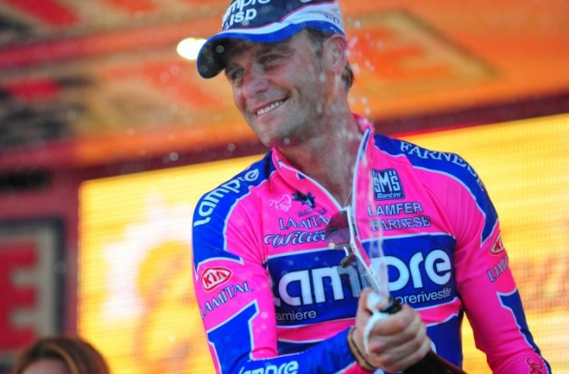 A proud Alessandro Petacchi celebrates his stage 2 win on the podium in Parma. Photo copyright Fotoreporter Sirotti.