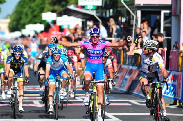 Alessandro Petacchi wins the stage 2 sprint to the finish line ahead of Mark Cavendish who clearly wasn't satisfied with Petacchi's sprint. Photo copyright Fotoreporter Sirotti. Alessandro Petacchi wins the stage 2 sprint to the finish line ahead of Mark Cavendish who clearly wasn't satisfied with Petacchi's sprint. Photo copyright Fotoreporter Sirotti.