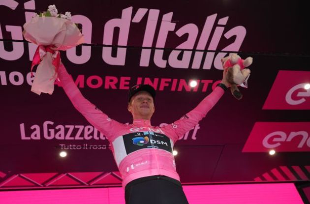 Andreas Leknessund on the podium wearing the pink jersey as leader of Giro d'Italia 2023