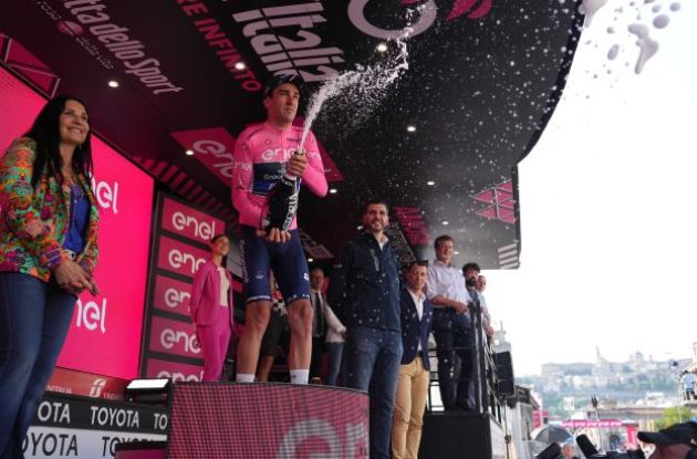 Bruno Armirail celebrates his Giro d'Italia lead with champagne on the podium
