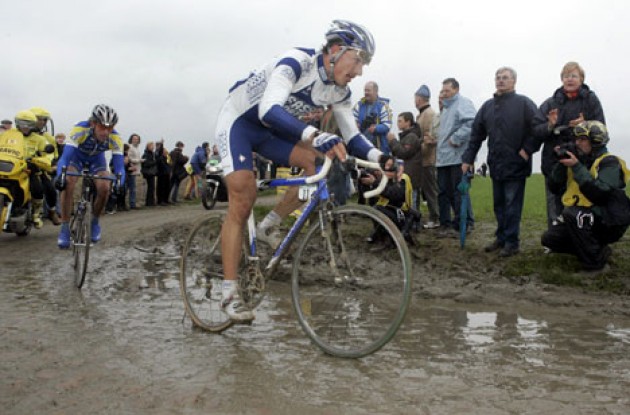 Cancellara combats a mix of mud and cobbles. Photo copyright Roadcycling.com. 