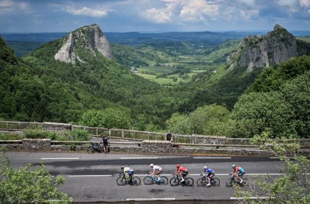 Cyclists passing French landscape