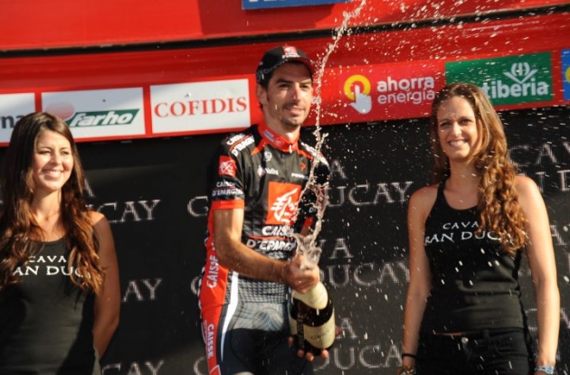 David Lopez Garcia celebrates his Vuelta stage win on the podium. Photo copyright Fotoreporter Sirotti.