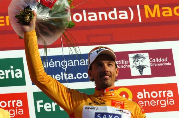 Fabian Cancellara in the golden jersey on the podium. Photo copyright Fotoreporter Sirotti.