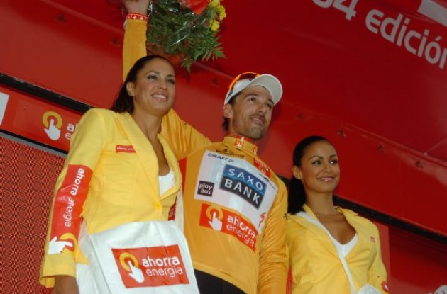 Fabian Cancellara on the podium with the nicely tanned podium girls. Photo copyright Fotoreporter Sirotti.