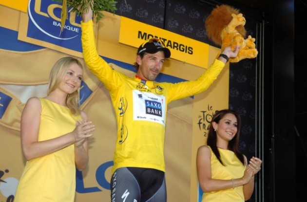 Fabain Cancellara has some quality time with the podium girls on the Tour de France podium. Can someone please send me the phone number of the left one? Wow! You're welcome to drop by! Photo copyright Fotoreporter Sirotti.