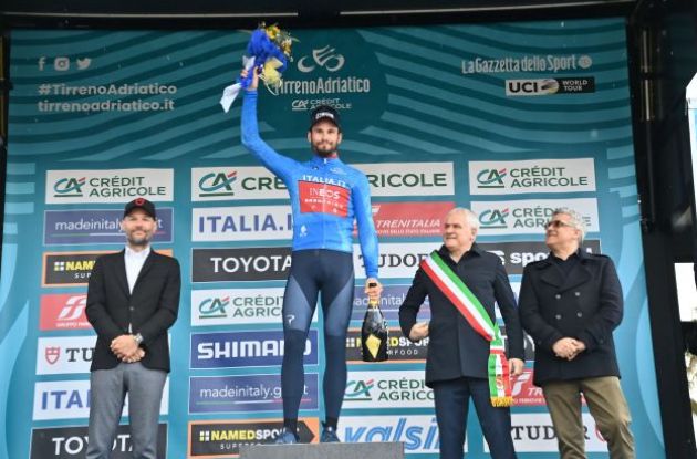 Stage winner Filippo Ganna is celebrated on the podium