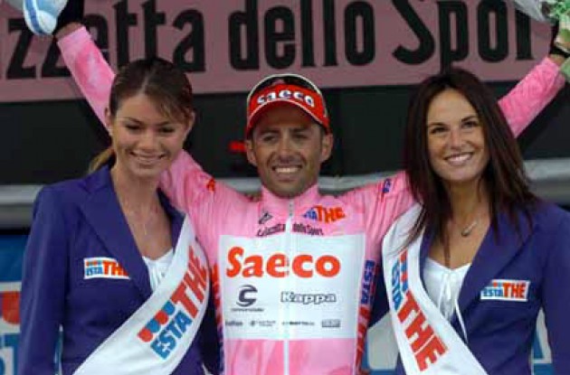 Look who's smiling now. Simoni looking set to win this year's edition of the special competition for most days with the Giro podium girls. Photo copyright Fotoreporter Sirotti.