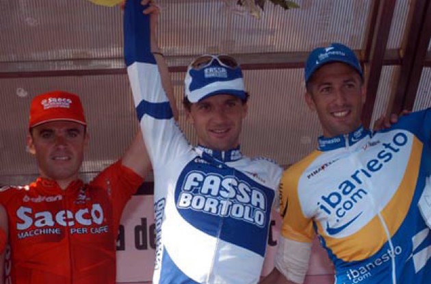 Bartoli (M), Celestino (L) and Flecha on the podium. Photo copyright Fotoreporter Sirotti.