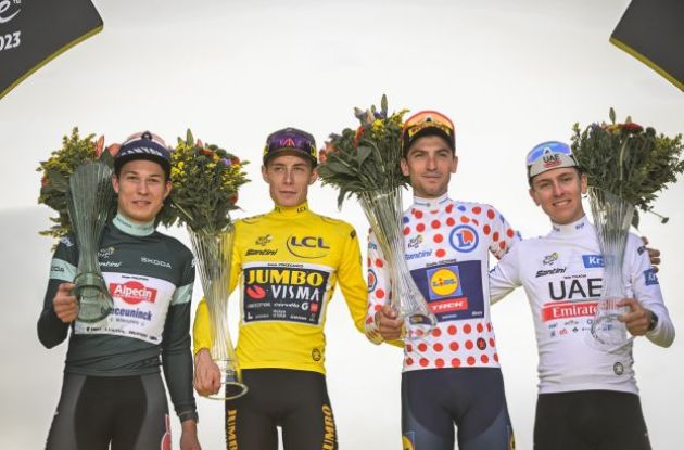 Jasper Philipsen Jonas Vingegaard Giulio Ciccone and Tadej Pogacar on the Tour de France podium in Paris