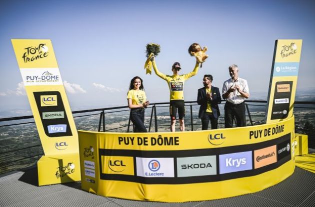 Jonas Vingegaard is celebrated on the podium as leader of Tour de France
