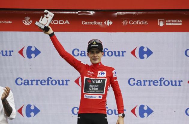 Jonas Vingegaard on the podium | A.S.O. Jonas Vingegaard celebrates his red jersey and race lead on the podium