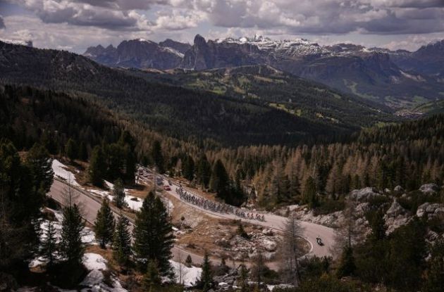 Cycling peloton in Dolomite mountains