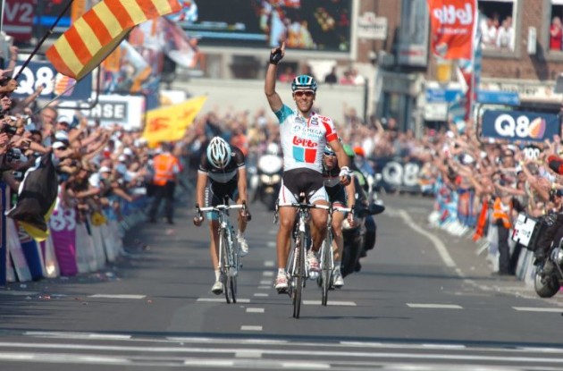 Team Omega Pharma-Lotto's Philippe Gilbert powers to victory in Liege-Bastogne-Liege ahead of Frank Schleck and Andy Schleck of Team Leopard-Trek. Photo Fotoreporter Sirotti.