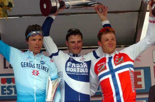 Top 3 on the podium. Petacchi (middle), Hondo (left), and Hushovd. Photo copyright Fotoreporter Sirotti.