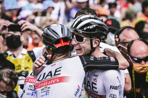 Adam Yates is congratulated by teammate Tadej Pogacar