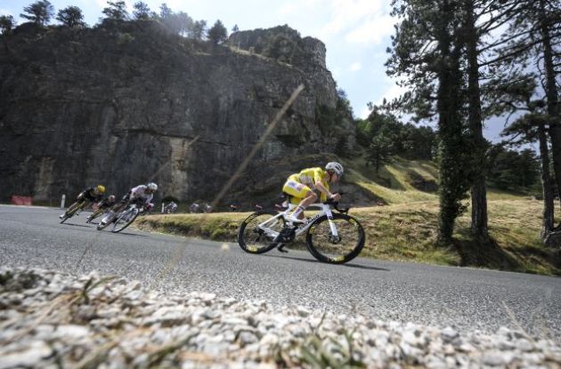 Tadej Pogacar cycling downhill during stage 15