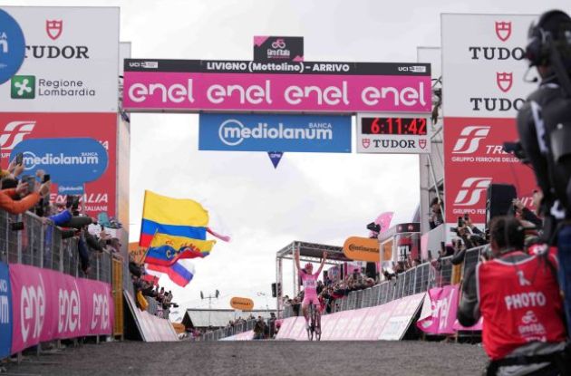 Tadej Pogacar crosses the finish line as winner of stage 15 of Giro d'Italia 2024 in Livigno