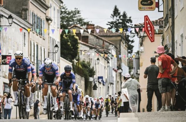 Tour de France riders received by spectators in French village