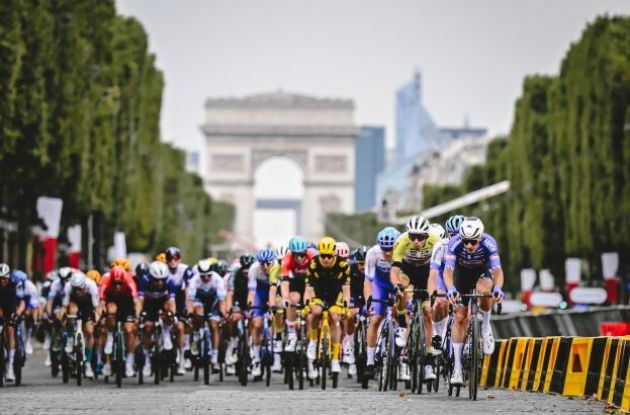 The Tour de France peloton on the Champs Elysees boulevard in Paris