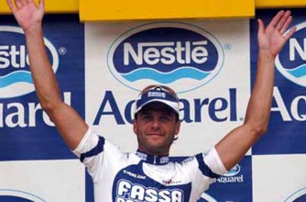 Pettachi celebrates his win o nthe podium - but McGee maintains the overall lead. Photo copyright Fotoreporter Sirotti.