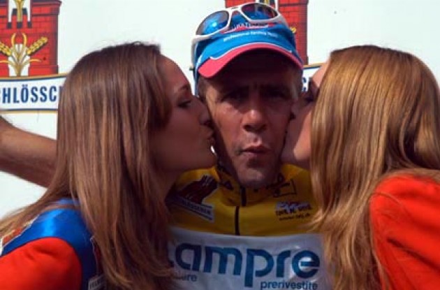 Casagrande spending some quality time with the podium girls. Wow! Photo copyright Fotoreporter Sirotti.