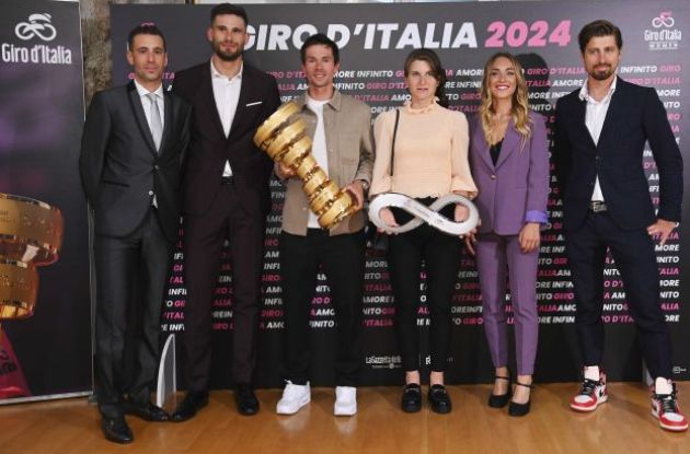 Professional cyclists with the Giro d'Italia trophies for 2024
