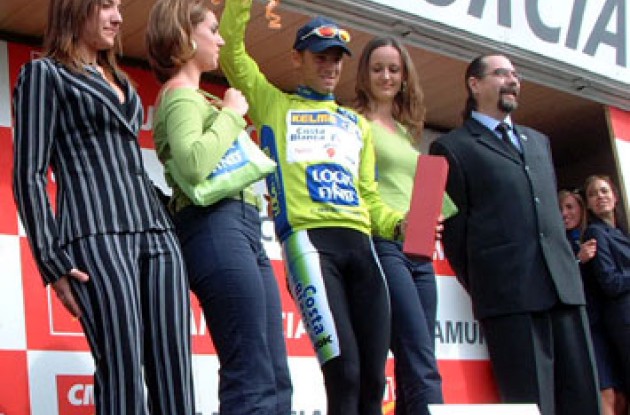 Alejandro Valverde celebrates his overall win on the podium in Spain.