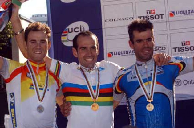 World Champion Igor Astarlia on the podium along with Valverde and Van Petegem. Photo copyright Fotoreporter Sirotti.