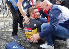 Remco Evenepoel bleeding from his face after crashing in Vuelta a Espana
