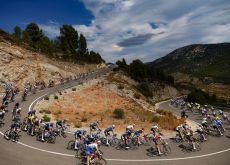 Cycling peloton cornering in spanish mountains