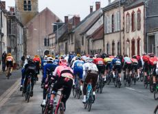 Cyclists cornering in French village during stage 2 of Paris-Nice 2023