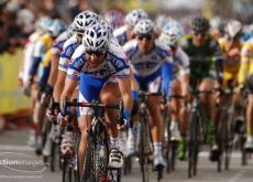 The train of Quick Step riders leads the peloton.