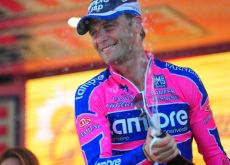 A proud Alessandro Petacchi celebrates his stage win on the Giro podium. Photo Fotoreporter Sirotti. A proud Alessandro Petacchi celebrates his stage win on the Giro podium. Photo Fotoreporter Sirotti.