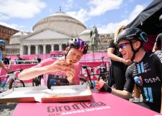 Andreas Leknessund eating pizza with a teammate in Naples at the start of stage 6 of Giro d'Italia